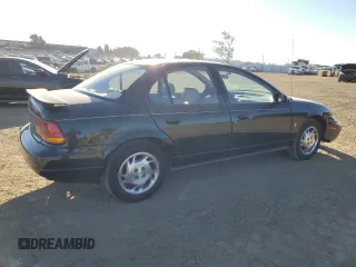1996 Saturn SL z VIN 1G8ZK527XTZ335205, wystawiony jako Copart lot #42230735 z przebiegiem 82 344 mil mil oraz Szkoda całkowita • Salvage title. Historia ofert i sprzedaży dostępna na DreamBid. Obrazek 3.