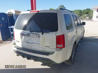 2015 Honda Pilot Touring with VIN 5FNYF3H98FB017564, listed as a IAAI auction lot 41587390 with 162,676 mi miles. Bid and sale history available at carsss.com. Image 4.