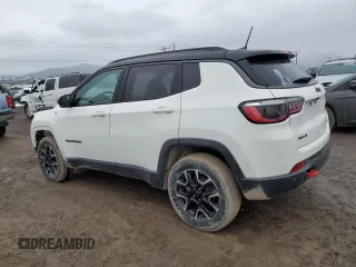 2021 Jeep Compass Trailhawk with VIN 3C4NJDDB5MT590369, listed as a Copart auction lot 46107685 with 67,857 mi miles and Salvage title. Bid and sale history available at DreamBid. Image 2.