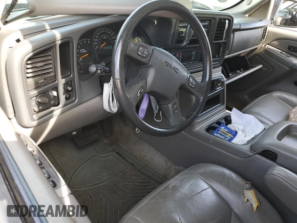 2005 GMC Yukon SLT z VIN 1GKEC13T25R136033, wystawiony jako Copart lot #48189995 z przebiegiem Nie podano mil oraz Szkoda całkowita • Salvage title. Historia ofert i sprzedaży dostępna na DreamBid. Obrazek 8.