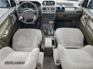 1995 Mitsubishi Montero z VIN JA4MR41H7SJ024208, wystawiony jako Copart lot #42971825 z przebiegiem 313 990 mil mil oraz Szkoda całkowita • Salvage title. Historia ofert i sprzedaży dostępna na DreamBid. Obrazek 8.