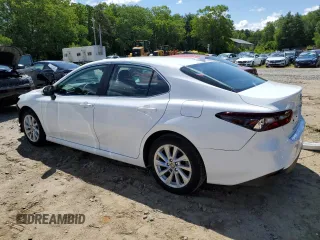 2023 Toyota Camry LE z VIN 4T1R11AK5PU792249, wystawiony jako Copart lot #58578705 z przebiegiem 20 839 mil mil oraz Szkoda całkowita • Salvage title. Historia ofert i sprzedaży dostępna na DreamBid. Obrazek 2.