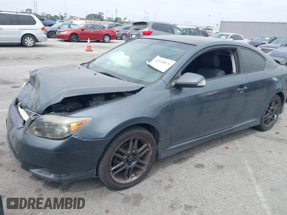 2005 Scion tC with VIN JTKDE177950042663, listed as a IAAI auction lot 42120575 with 255,225 mi miles. Bid and sale history available at carsss.com. Image 2.