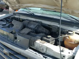 2004 Ford Econoline Cargo with VIN 1FTRE14W44HA29084, listed as a IAAI auction lot 41793350 with 123,429 mi miles and . Bid and sale history available at DreamBid. Image 18.