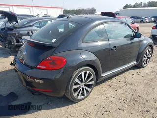 2012 Volkswagen Beetle 2.0T Turbo with VIN 3VWV67ATXCM648515, listed as a IAAI auction lot 41666994 with 142,085 mi miles. Bid and sale history available at carsss.com. Image 4.