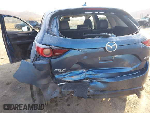 2018 Mazda CX-5 Touring z VIN JM3KFBCM2J0461954, wystawiony jako IAAI lot #41655865 z przebiegiem 129 333 mil mil oraz . Historia ofert i sprzedaży dostępna na DreamBid. Obrazek 6.