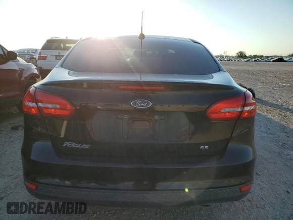 2017 Ford Focus SE with VIN 1FADP3F25HL219608, listed as a Copart auction lot 56559925 with 100,207 mi miles and Salvage title. Bid and sale history available at DreamBid. Image 6.