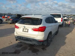 2016 BMW X1 xDrive28i with VIN WBXHT3C3XGP889461, listed as a IAAI auction lot 41757627 with 105,681 mi miles. Bid and sale history available at carsss.com. Image 4.