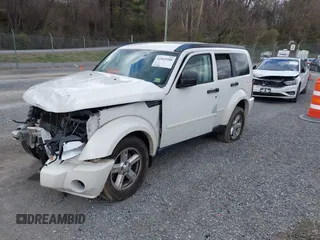 2007 Dodge Nitro SXT with VIN 1D8GU28K77W727391, listed as a IAAI auction lot 41869288 with 214,920 mi miles. Bid and sale history available at carsss.com. Image 2.
