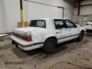 1992 Dodge Dynasty LE z VIN 1B3XC56RXND822802, wystawiony jako Copart lot #82799714 z przebiegiem 137 131 mil mil oraz Szkoda całkowita • Salvage title. Historia ofert i sprzedaży dostępna na DreamBid. Obrazek 3.