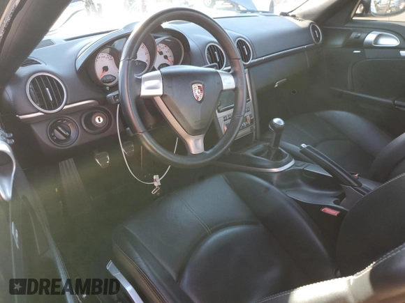 2006 Porsche Cayman S с VIN WP0AB29866U782423, выставлен на аукционе Copart как лот 87725325 с пробегом 51 686 миль миль и Списание • Salvage title. История ставок и продаж доступна на DreamBid. Изображение 8.