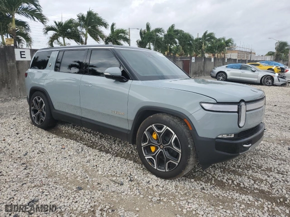 2024 Rivian R1S Adventure with VIN 7PDSGABA1RN031380, listed as a Copart auction lot 73119354 with 6,786 mi miles and Salvage Title. Bid and sale history available at carsss.com. Image 4.