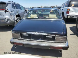 1990 Jaguar XJ with VIN SAJKY1745LC622713, listed as a Copart auction lot 56545414 with Not Provided miles and Salvage Title. Bid and sale history available at DreamBid. Image 6.