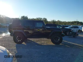 2015 Jeep Wrangler Unlimited Rubicon with VIN 1C4BJWFGXFL610153, listed as a IAAI auction lot 41575401 with 114,583 mi miles. Bid and sale history available at carsss.com. Image 13.