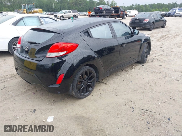 2013 Hyundai Veloster w/Black Int with VIN KMHTC6AD3DU084995, listed as a IAAI auction lot 42513920 with 103,595 mi miles and . Bid and sale history available at DreamBid. Image 4.