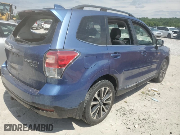 2017 Subaru Forester Touring with VIN JF2SJGTC2HH404923, listed as a Copart auction lot 58091885 with 101,317 mi miles and Salvage title. Bid and sale history available at DreamBid. Image 3.