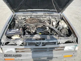 1989 Nissan Hardbody z VIN 1N6ND16S2KC377484, wystawiony jako Copart lot #65412324 z przebiegiem 31 573 mil mil oraz Szkody całkowita. Historia ofert i sprzedaży dostępna na DreamBid. Obrazek 12.