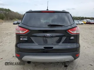2016 Ford Escape SE with VIN 1FMCU9GX5GUB02417, listed as a Copart auction lot 51762985 with 97,535 mi miles and Salvage Title. Bid and sale history available at DreamBid. Image 6.
