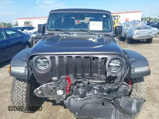 2021 Jeep Wrangler Unlimited Rubicon with VIN 1C4HJXFN5MW509483, listed as a IAAI auction lot 42245703 with 59,461 mi miles and . Bid and sale history available at DreamBid. Image 12.
