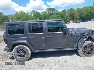2017 Jeep Wrangler Unlimited Sahara with VIN 1C4BJWEG4HL605213, listed as a IAAI auction lot 42247221 with 104,542 mi miles and . Bid and sale history available at DreamBid. Image 13.