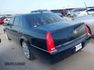 2006 Cadillac DTS w/1SC with VIN 1G6KD57Y26U156907, listed as a IAAI auction lot 42101639 with 188,886 mi miles. Bid and sale history available at carsss.com. Image 3.