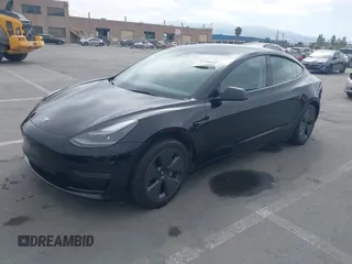 2023 Tesla Model 3 with VIN 5YJ3E1EA5PF647737, listed as a IAAI auction lot 42430145 with 20,525 mi miles and . Bid and sale history available at DreamBid. Image 2.