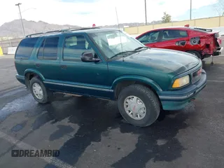 1997 GMC Jimmy SLS with VIN 1GKDT13W7V2516192, listed as a IAAI auction lot 41442979 with 154,518 mi miles. Bid and sale history available at carsss.com. Image 1.