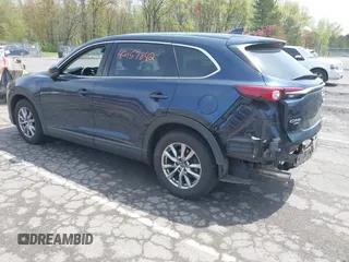 2019 Mazda CX-9 Touring z VIN JM3TCBCY6K0331905, wystawiony jako IAAI lot #42157842 z przebiegiem 84 211 mil mil oraz . Historia ofert i sprzedaży dostępna na DreamBid. Obrazek 3.