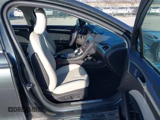 2016 Ford Fusion Titanium Hybrid with VIN 3FA6P0RU6GR156622, listed as a IAAI auction lot 41178887 with 92,423 mi miles. Bid and sale history available at carsss.com. Image 5.
