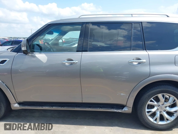 2012 Infiniti QX56 7-passenger z VIN JN8AZ2NF9C9517675, wystawiony jako IAAI lot #42138696 z przebiegiem 129 478 mil mil oraz . Historia ofert i sprzedaży dostępna na DreamBid. Obrazek 14.