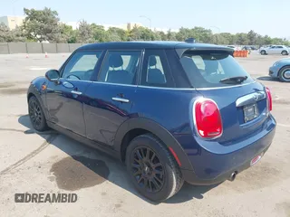 2015 MINI Hardtop 4 Door with VIN WMWXS5C50FT830060, listed as a IAAI auction lot 42744826 with 99,813 mi miles and . Bid and sale history available at DreamBid. Image 3.
