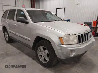 2007 Jeep Grand Cherokee Laredo with VIN 1J8GR48K57C687365, listed as a IAAI auction lot 42038456 with 162,343 mi miles. Bid and sale history available at carsss.com. Image 1.