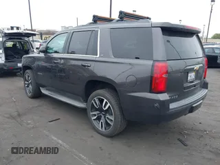 2015 Chevrolet Tahoe LT with VIN 1GNSCBKC1FR233898, listed as a IAAI auction lot 42004048 with 115,779 mi miles and . Bid and sale history available at DreamBid. Image 3.