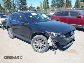 2020 Mazda CX-5 Grand Touring with VIN JM3KFBDM7L0724005, listed as a IAAI auction lot 42034658 with 90,631 mi miles. Bid and sale history available at carsss.com. Image 1.