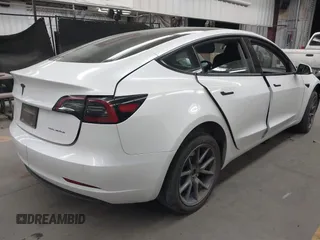 2023 Tesla Model 3 Long Range with VIN 5YJ3E1EB3PF603955, listed as a IAAI auction lot 41915541 with 33,691 mi miles and . Bid and sale history available at DreamBid. Image 4.