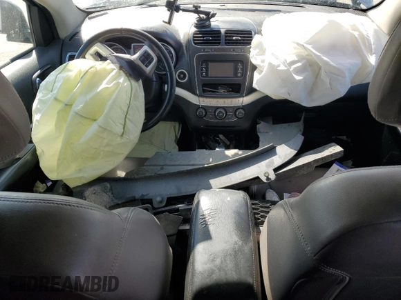 2015 Dodge Journey American Value with VIN 3C4PDCABXFT712192, listed as a Copart auction lot 55680975 with 104,579 mi miles and Salvage Title. Bid and sale history available at DreamBid. Image 8.