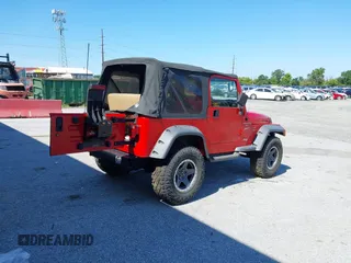 1999 Jeep Wrangler Sport with VIN 1J4FY19S0XP468304, listed as a IAAI auction lot 40038580 with 123,247 mi miles. Bid and sale history available at carsss.com. Image 4.