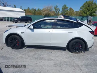 2023 Tesla Model Y Long Range with VIN 7SAYGAEE1PF665934, listed as a IAAI auction lot 41780949 with 21,949 mi miles and . Bid and sale history available at DreamBid. Image 13.