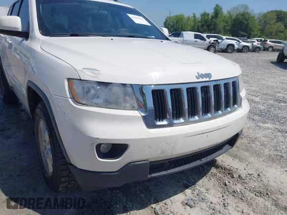 2011 Jeep Grand Cherokee Laredo with VIN 1J4RS4GG5BC573337, listed as a IAAI auction lot 41960369 with 185,518 mi miles and . Bid and sale history available at DreamBid. Image 6.