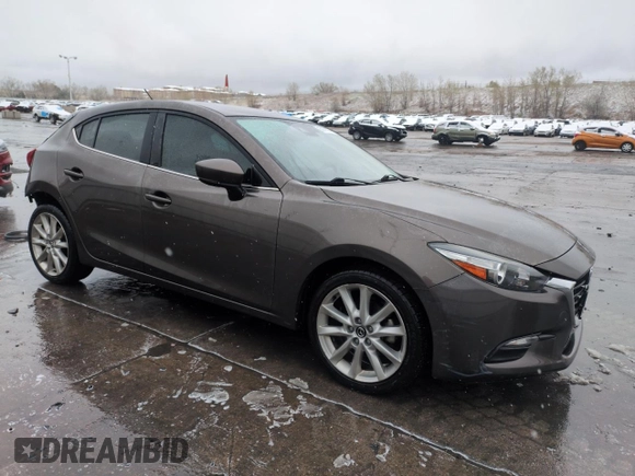 2017 Mazda 3 Touring with VIN 3MZBN1L70HM117494, listed as a Copart auction lot 53679635 with 127,751 mi miles and Salvage Title. Bid and sale history available at DreamBid. Image 4.