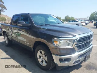 2021 Ram 1500 Lone Star with VIN 1C6RREFT5MN630771, listed as a IAAI auction lot 42598857 with 59,159 mi miles and . Bid and sale history available at DreamBid. Image 1.