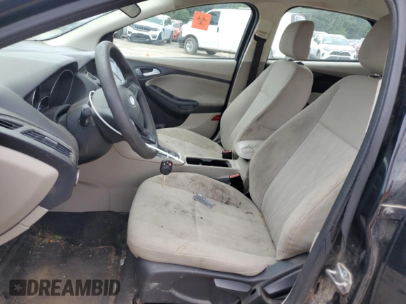 2018 Ford Focus SE z VIN 1FADP3F28JL319269, wystawiony jako Copart lot #59604555 z przebiegiem 167 726 mil mil oraz Szkoda całkowita • Salvage title. Historia ofert i sprzedaży dostępna na DreamBid. Obrazek 7.