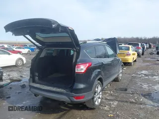 2014 Ford Escape Titanium with VIN 1FMCU9J9XEUC15464, listed as a IAAI auction lot 41524925 with 160,445 mi miles. Bid and sale history available at carsss.com. Image 4.