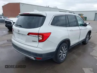 2021 Honda Pilot EX-L with VIN 5FNYF6H55MB031305, listed as a IAAI auction lot 41476636 with 58,754 mi miles. Bid and sale history available at carsss.com. Image 4.