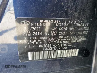 2023 Genesis G70 2.0T with VIN KMTG34TA5PU110175, listed as a Copart auction lot 58297715 with 43,716 mi miles and Salvage title. Bid and sale history available at DreamBid. Image 12.