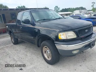 2000 Ford F-150 XL with VIN 1FTRX18LXYNB58643, listed as a IAAI auction lot 42100553 with 382,492 mi miles. Bid and sale history available at carsss.com. Image 1.