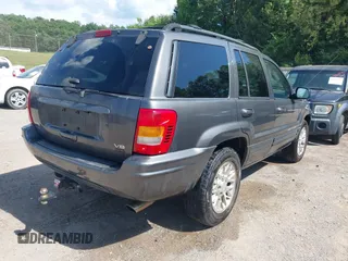 2002 Jeep Grand Cherokee Limited with VIN 1J4GW58J02C163931, listed as a IAAI auction lot 42632552 with 228,955 mi miles and . Bid and sale history available at DreamBid. Image 4.