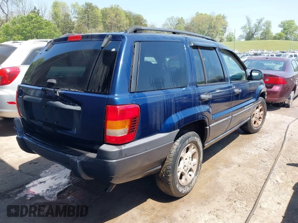 2003 Jeep Grand Cherokee Laredo with VIN 1J4GX48S83C548090, listed as a IAAI auction lot 42039918 with 243,209 mi miles. Bid and sale history available at carsss.com. Image 4.