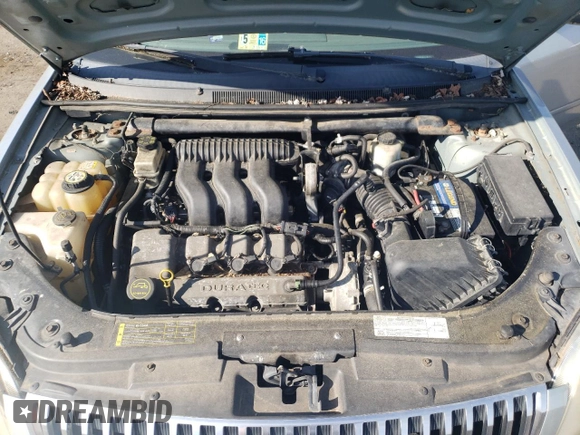 2006 Mercury Montego Luxury z VIN 1MEFM40116G601835, wystawiony jako Copart lot #85929224 z przebiegiem Nie podano mil oraz Szkoda całkowita • Salvage title. Historia ofert i sprzedaży dostępna na DreamBid. Obrazek 11.