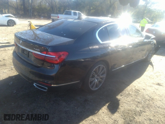 2018 BMW 7 Series 740i with VIN WBA7E2C57JG742257, listed as a IAAI auction lot 41353435 with 77,125 mi miles. Bid and sale history available at carsss.com. Image 4.